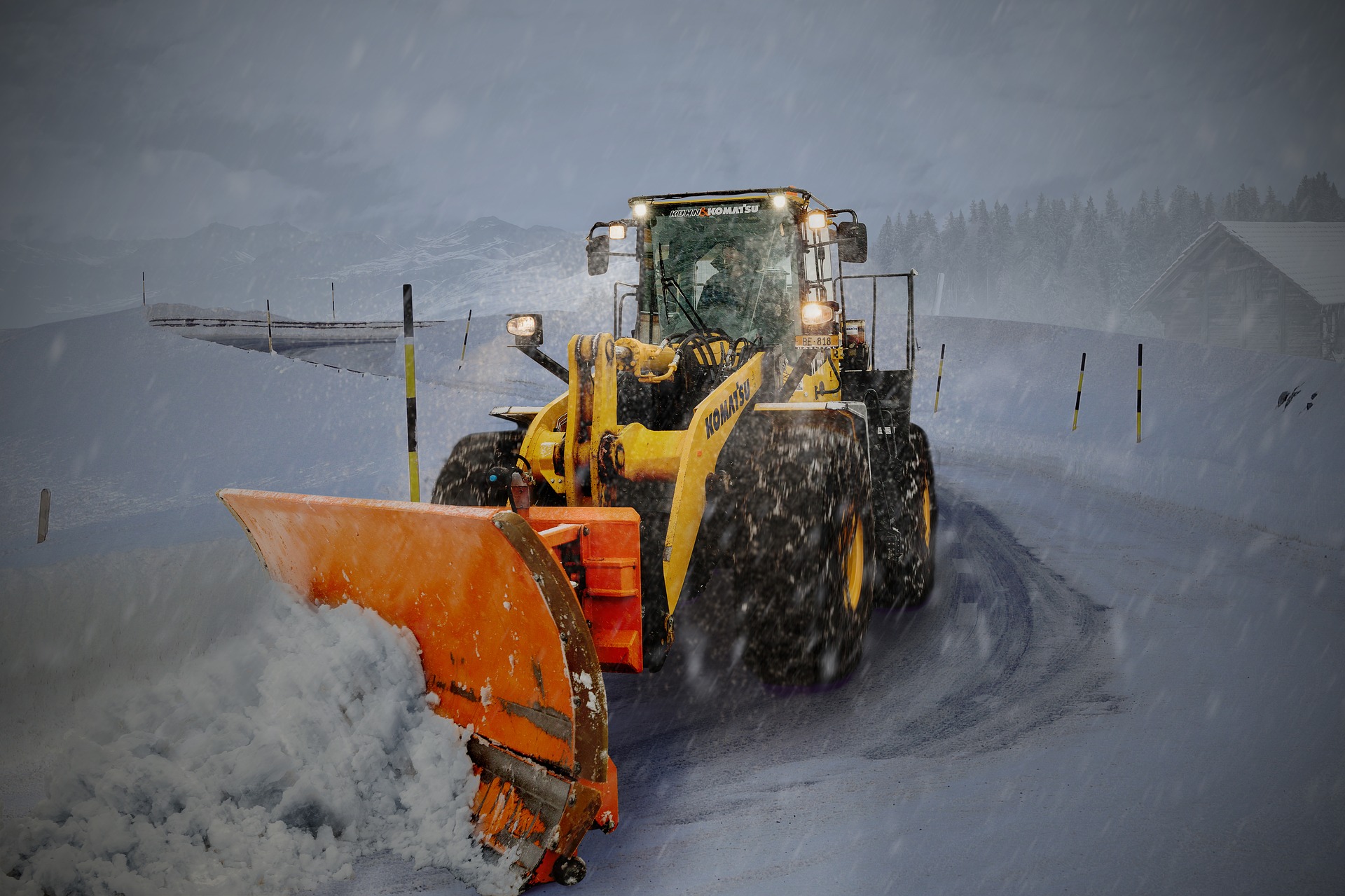 snow removal at night with lights on