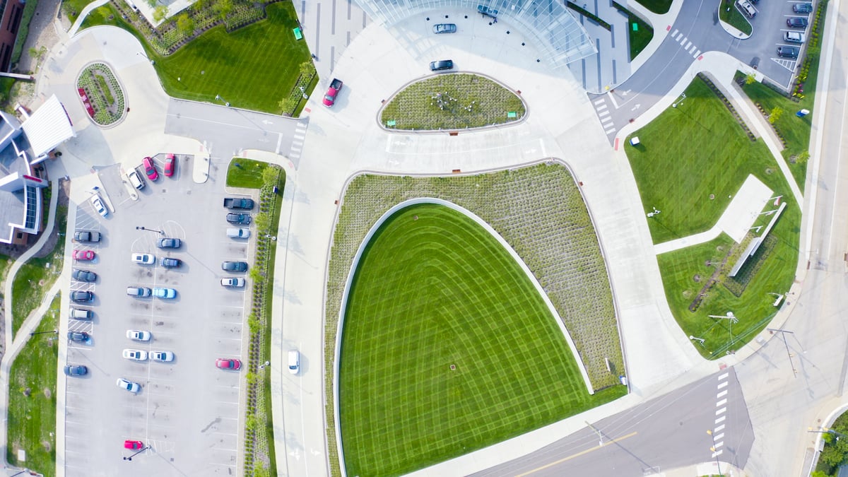 aerial view of lawn and hardscape at commercial property