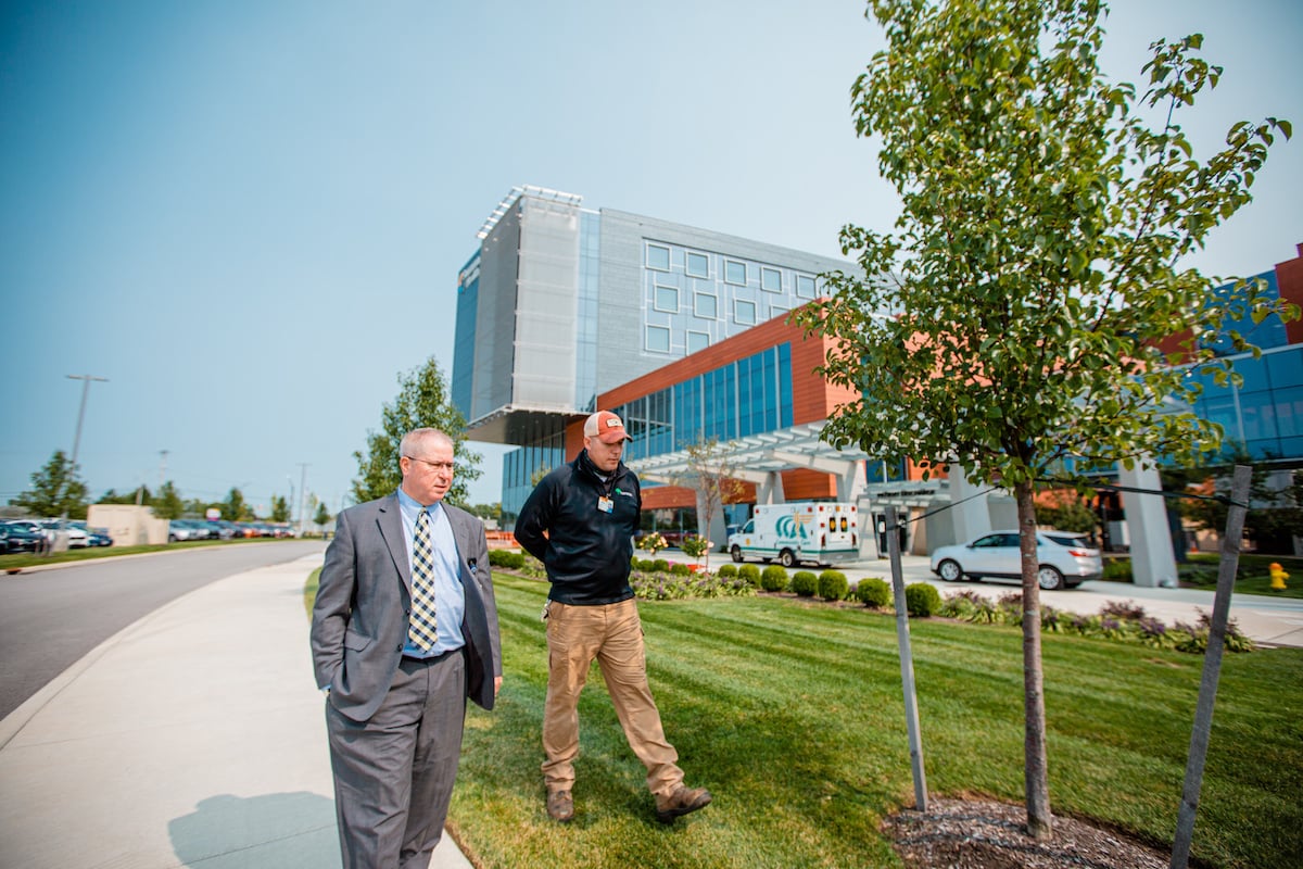 client walks through commercial property with manager 