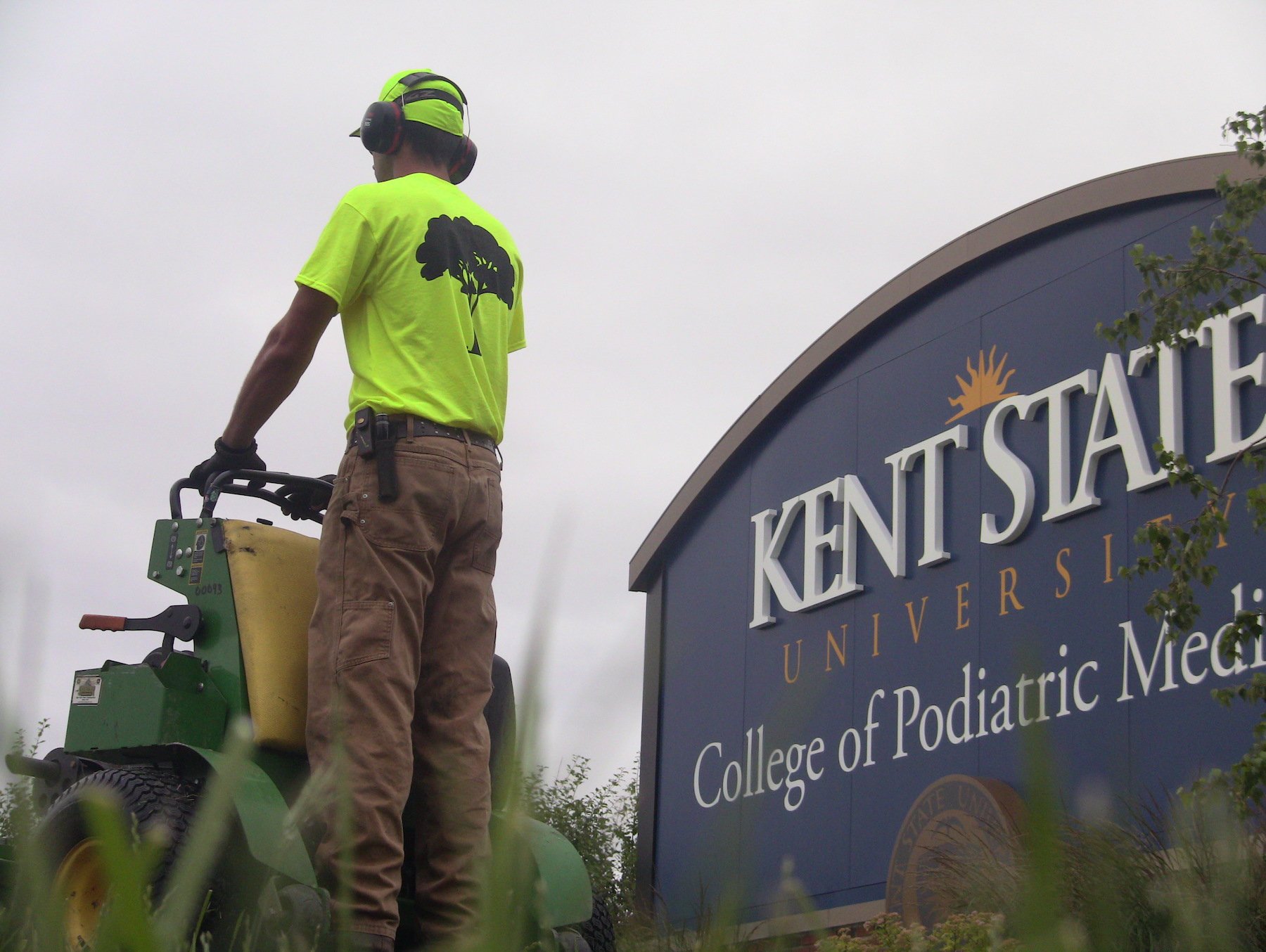 landscaping around college campus sign