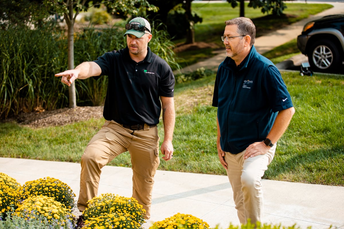 Commercial Landscaping Account Manager and Customer talking plantings