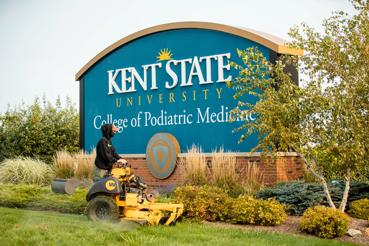 Commercial Landscaping Crew Mowing at Kent State University College