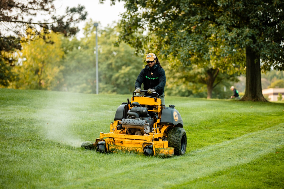 Commercial Landscaping crew mowing HOA lawn