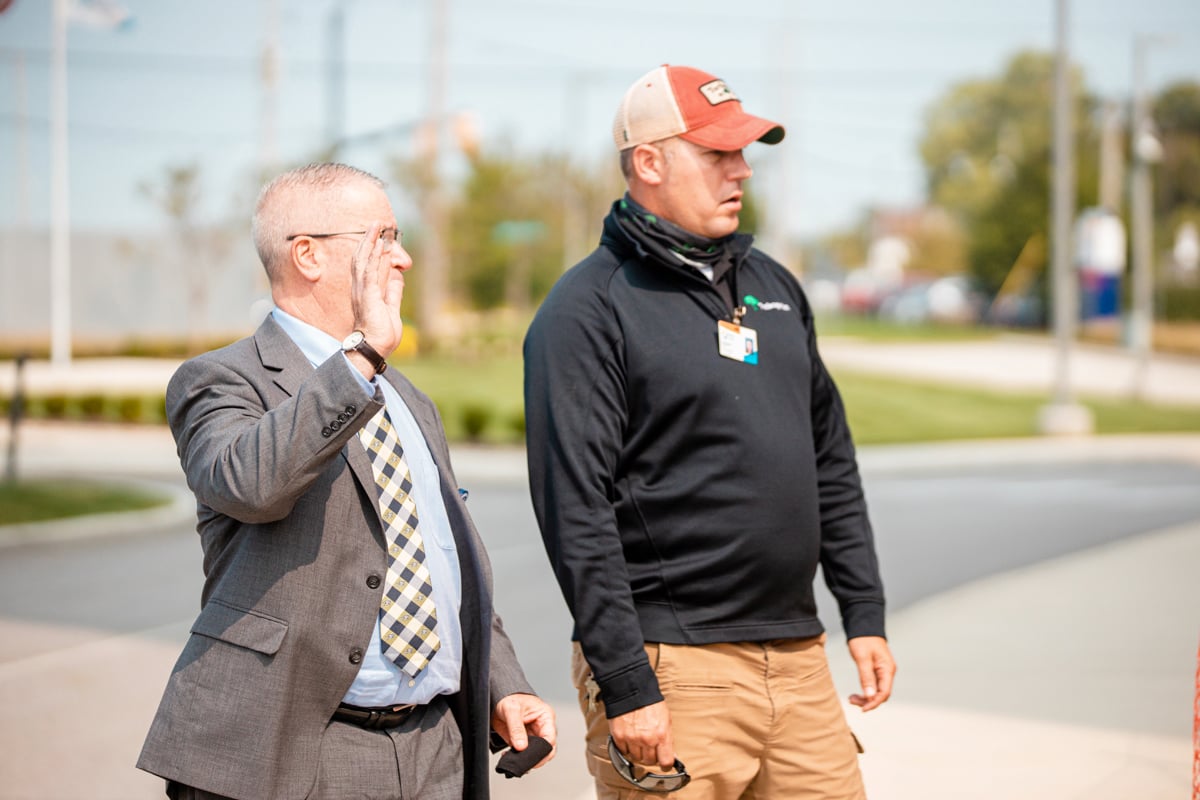 commercial landscape manager meets with business owner