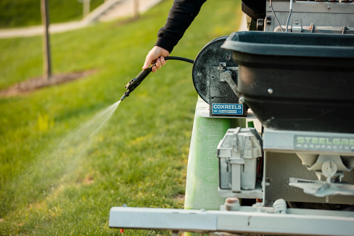 lawn being sprayed from ride on fertilizer