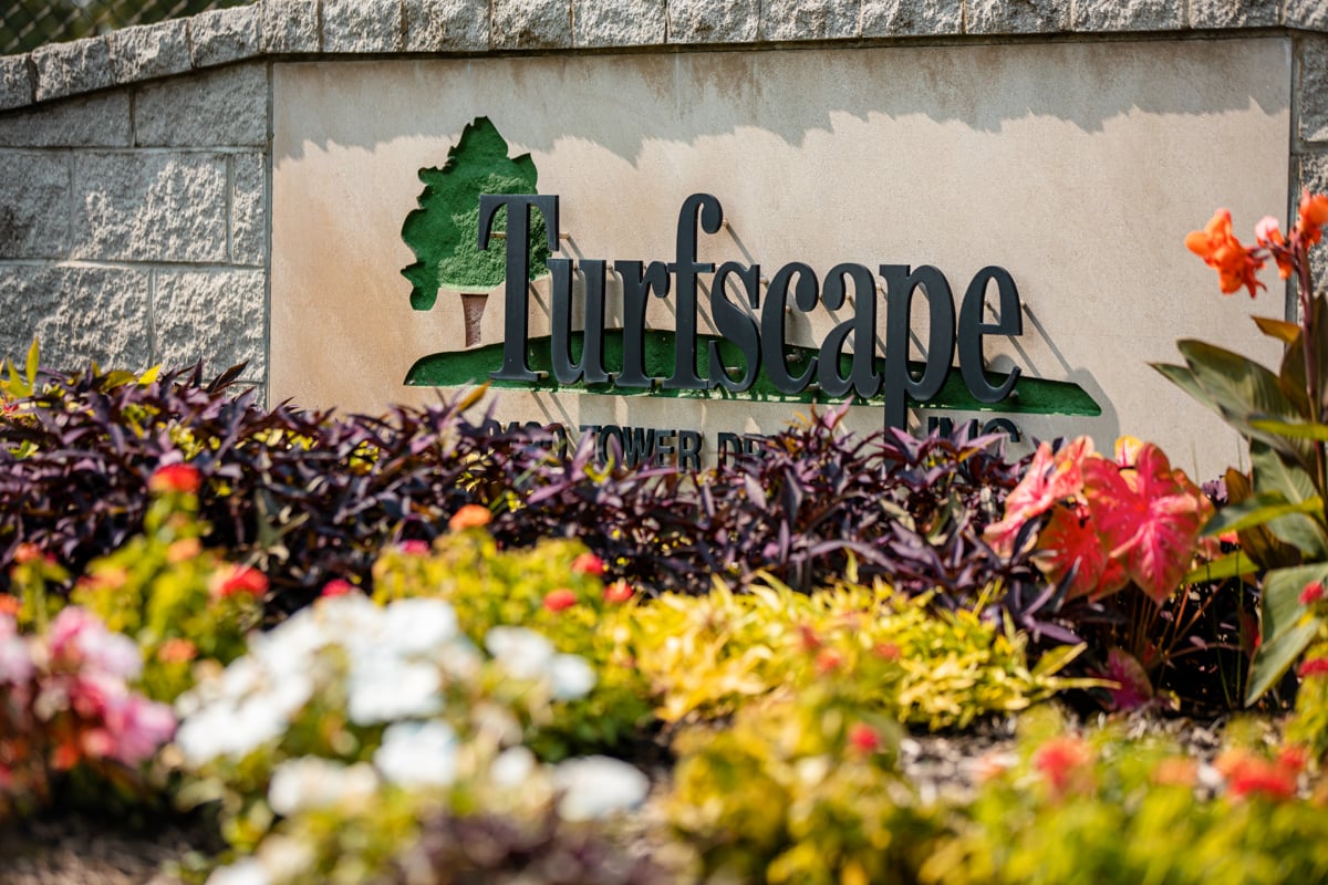 Turfscape sign with colorful flowers