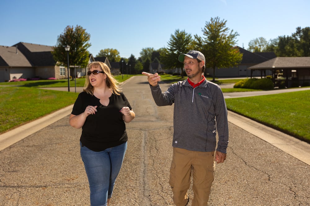 account manager and project manager walk down street