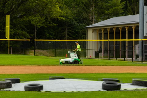 Autonomous commercial robotic mower crew rding athletic field 