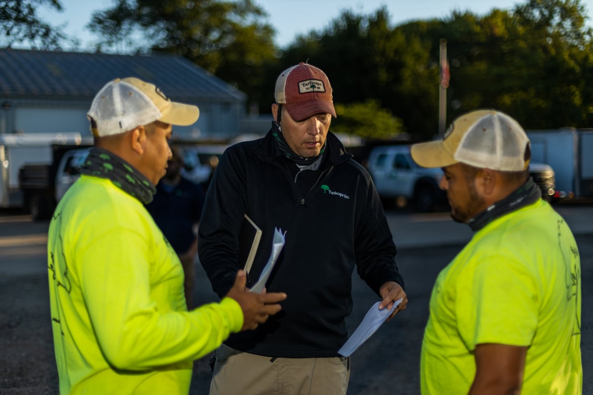 Crew talking with paperwork