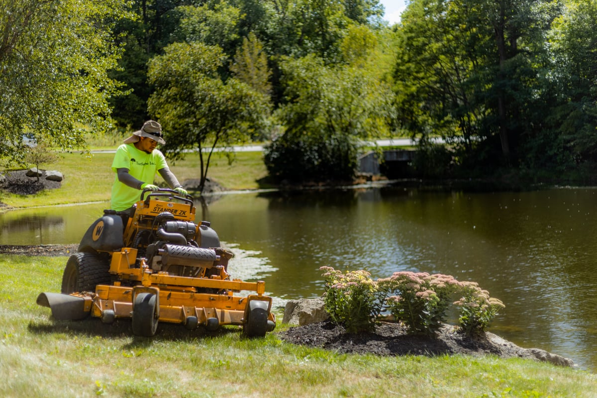 HOA mowing around pond