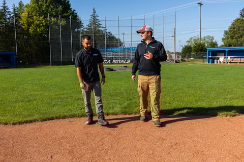 account manager with customer at baseball field 2
