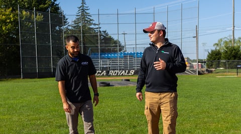 account manager with customer at baseball field 3