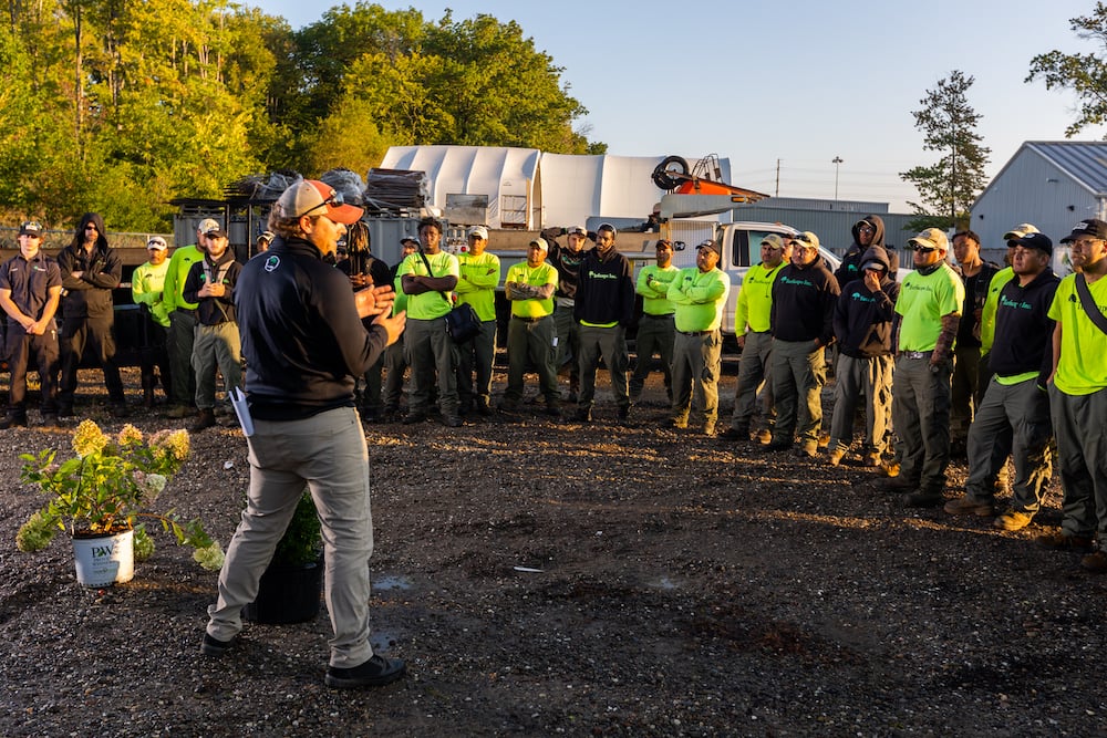 crew meeting outside with the team 1