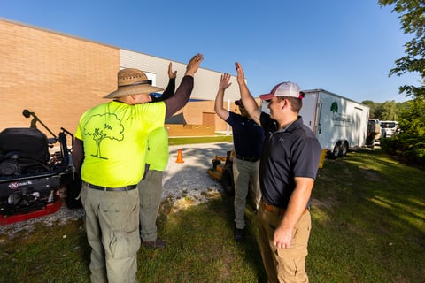 crew talking outside near equipment 3