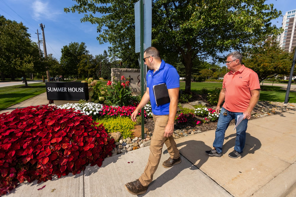 customer with account manager looking at flower beds