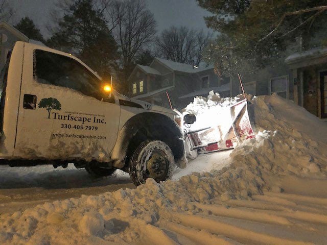 commercial snow removal at night