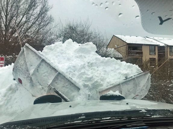 snow pile in front of plow