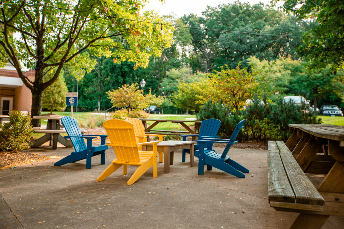 outdoor classroom seating area with trees for covering