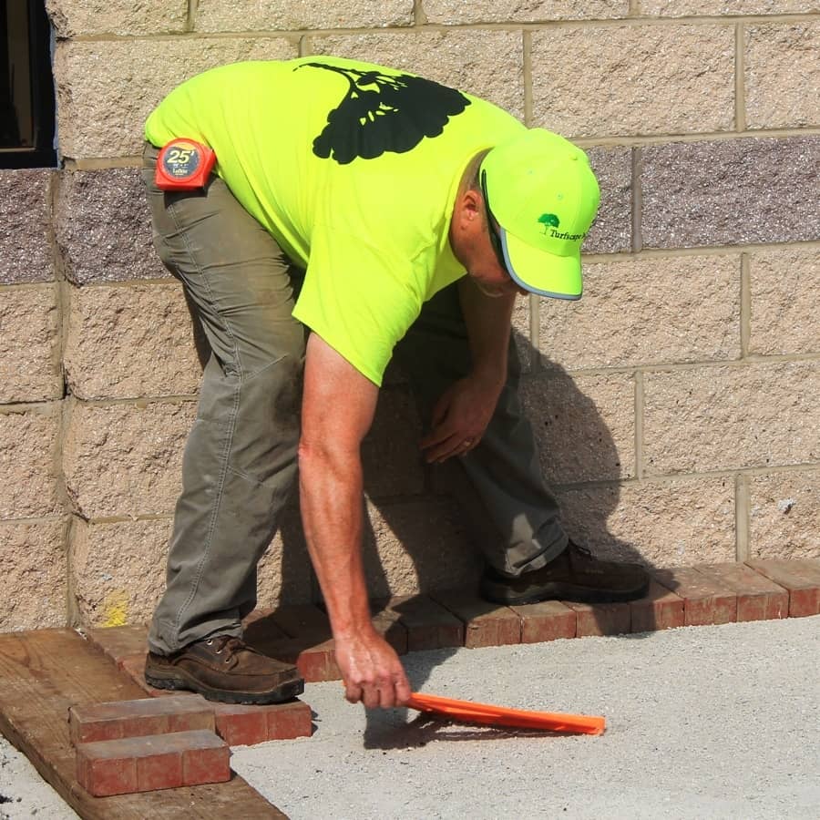 crew installing patio to combat erosion issues