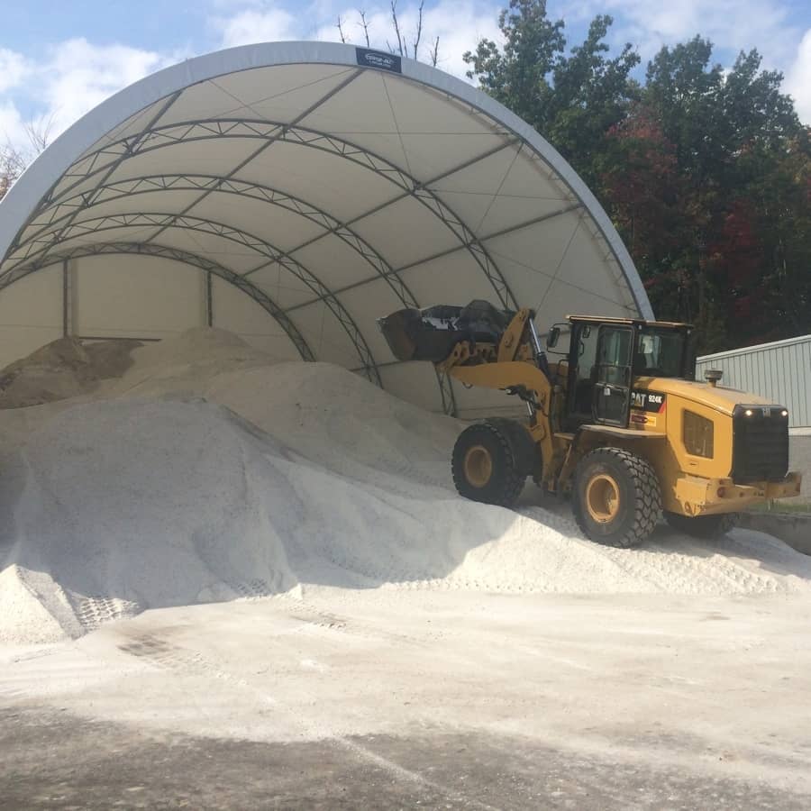 loader gets salt from large pile