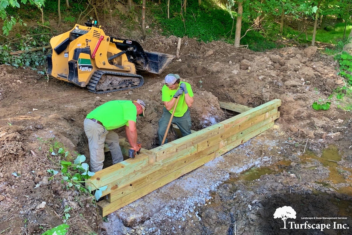 Turfscape crew installing an erosion control wall