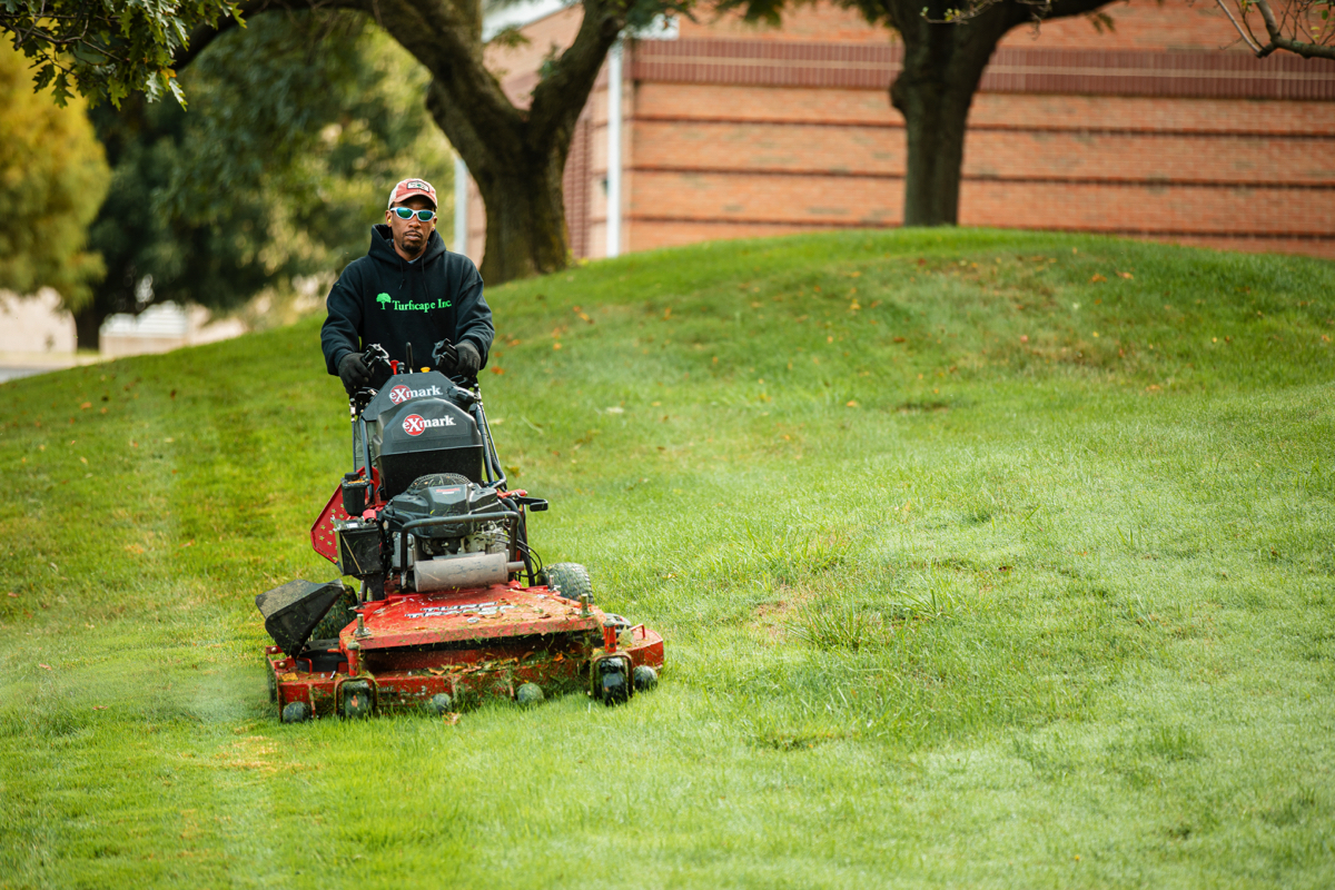 Commercial Landscaping Crew Mowing Lawn Care Maintenance 4