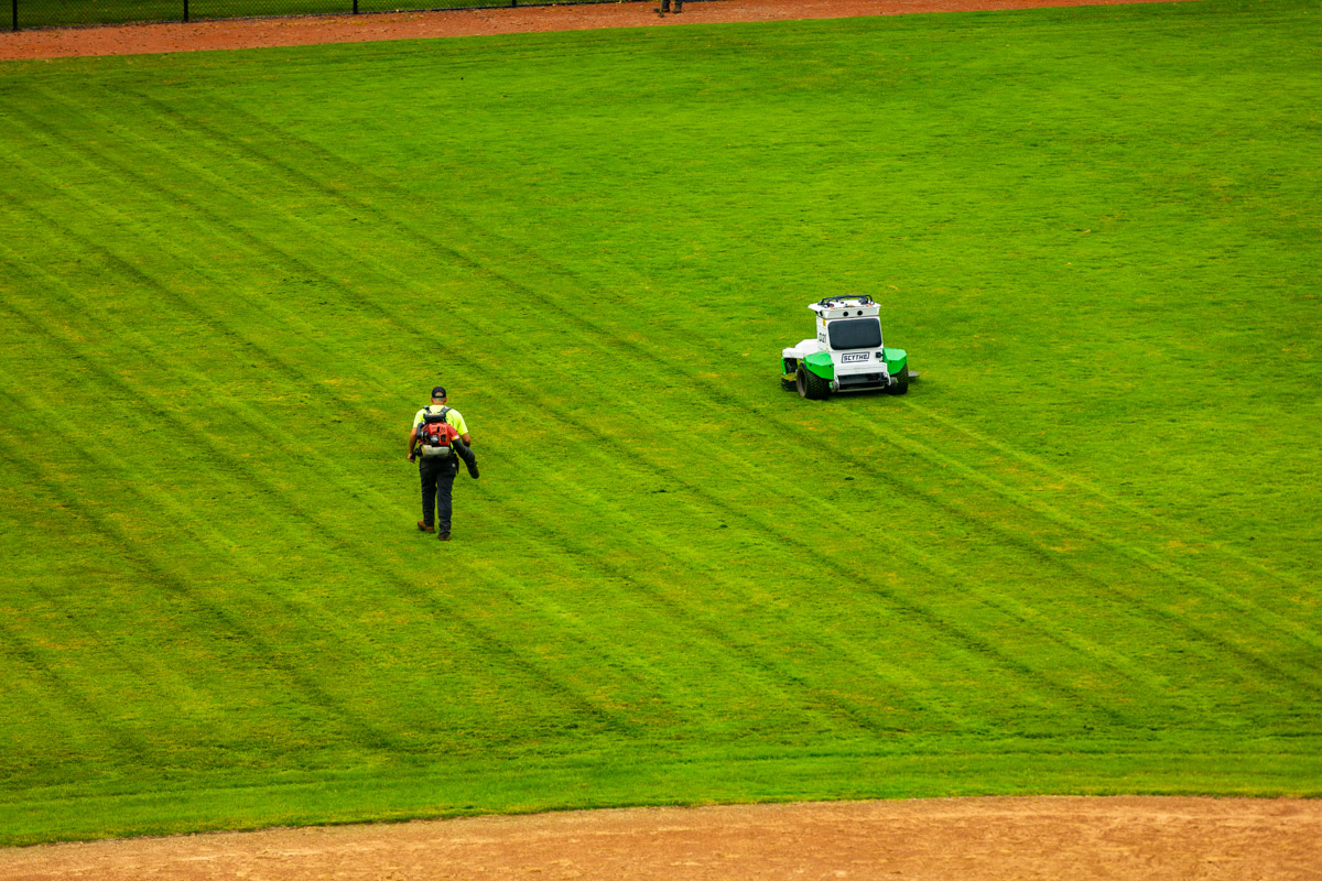 Autonomous commercial robotic mower university athletic field crew blowing 1