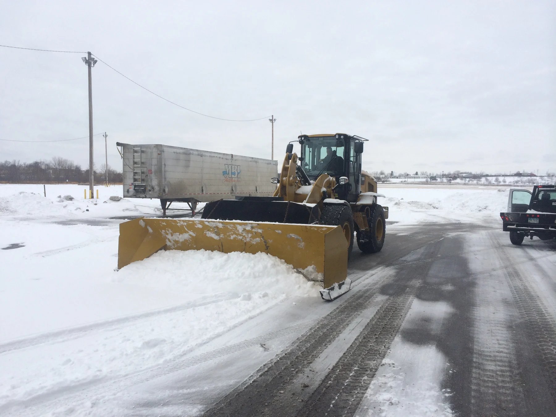 Snow removal equipment removing snow
