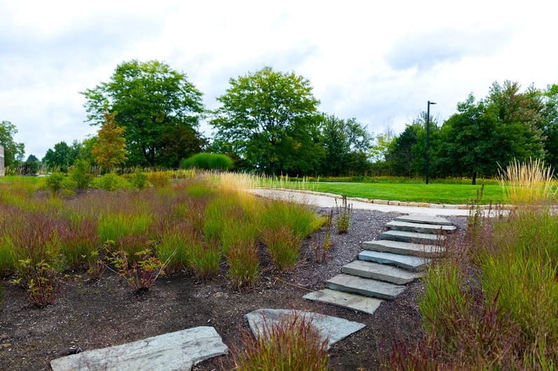 Enhancement paver walkway through flower beds